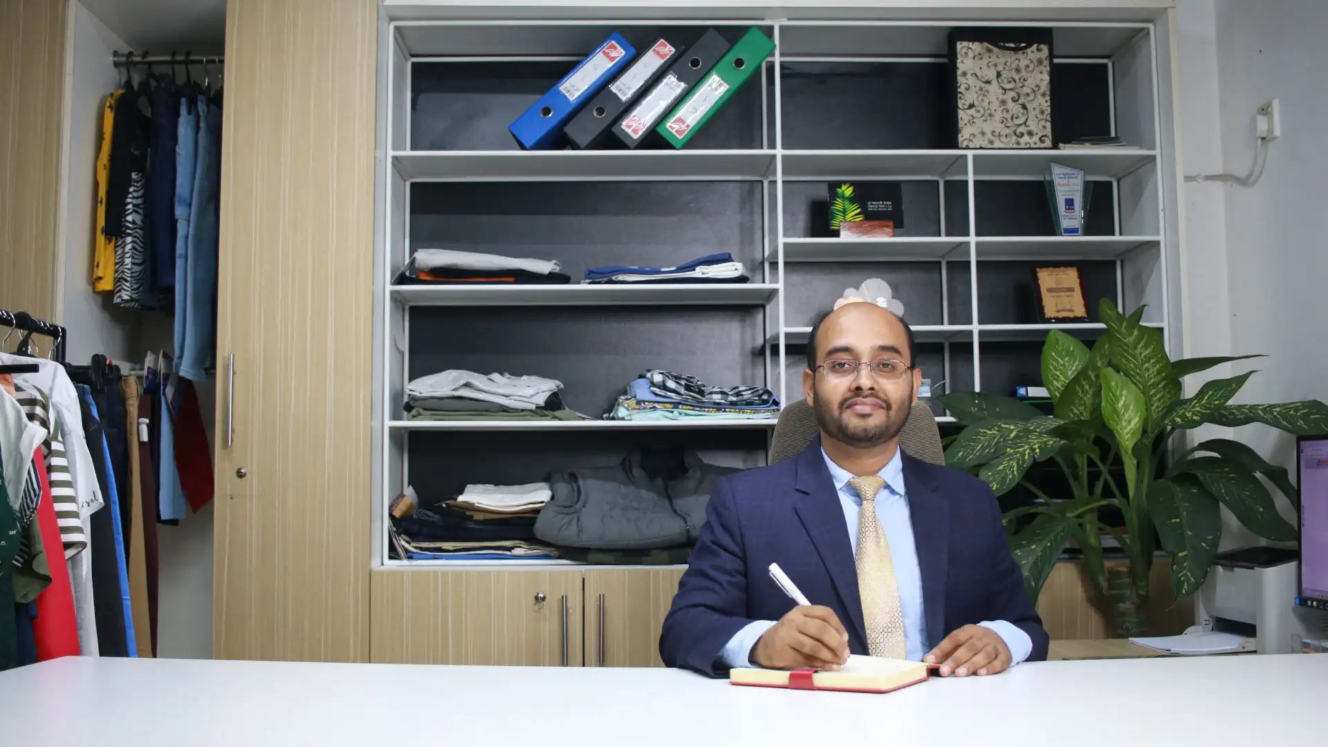 Managing Director Matiur Rahman inside the office of RYZEAL SOURCING, a clothing manufacturer and apparel sourcing company in Bangladesh.