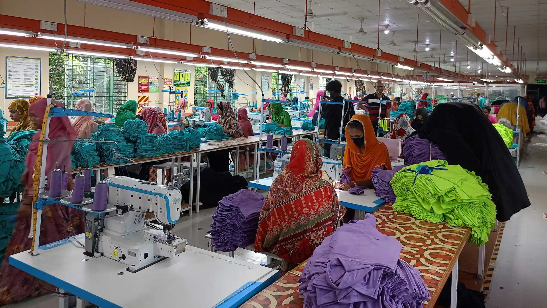 Workers engaged in garment production at a partner factory of RYZEAL SOURCING, a clothing manufacturer and apparel sourcing company in Bangladesh.